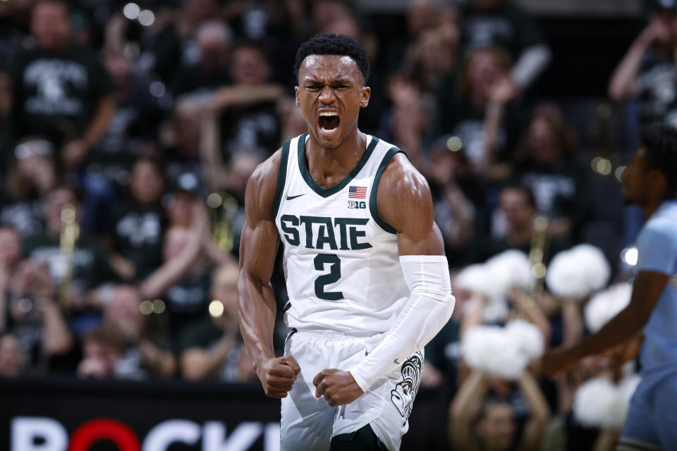 Michigan State guard Tyson Walker (2) celebrates after hitting a 3-pointer against Indiana State during the first half of an NCAA college basketball game, Saturday, Dec. 30, 2023, in East Lansing, Mich. (AP Photo/Al Goldis)