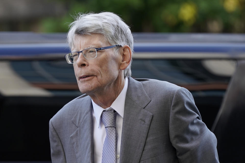 FILE - Author Stephen King arrives at federal court before testifying for the Department of Justice as it bids to block the proposed merger of two of the world's biggest publishers, Penguin Random House and Simon & Schuster, Aug. 2, 2022, in Washington. Through the first week of trial, top publishing executives at Penguin Random House, Simon & Schuster and elsewhere, along with agents and such authors as Stephen King have shared opinions, relived disappointments and revealed numbers they otherwise would have preferred to discuss privately or confide on background with reporters. (AP Photo/Patrick Semansky, File)