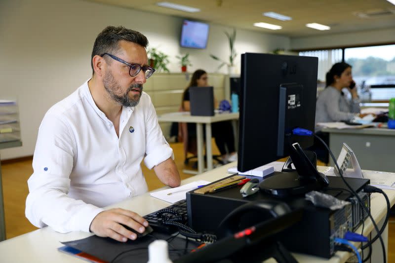 Rui Brito, a worker with a disability works at the office in Porto