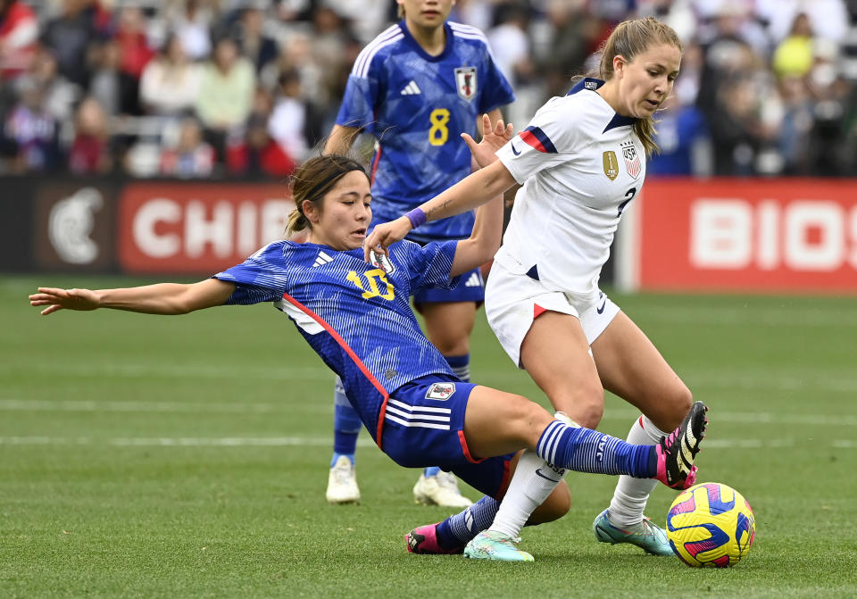 Japan forward Mana Iwabuchi (10) and United States midfielder Ashley Sanchez, right, battle for the ball during the second half of a SheBelieves Cup women's soccer match Sunday, Feb. 19, 2023, in Nashville, Tenn. (AP Photo/Mark Zaleski)