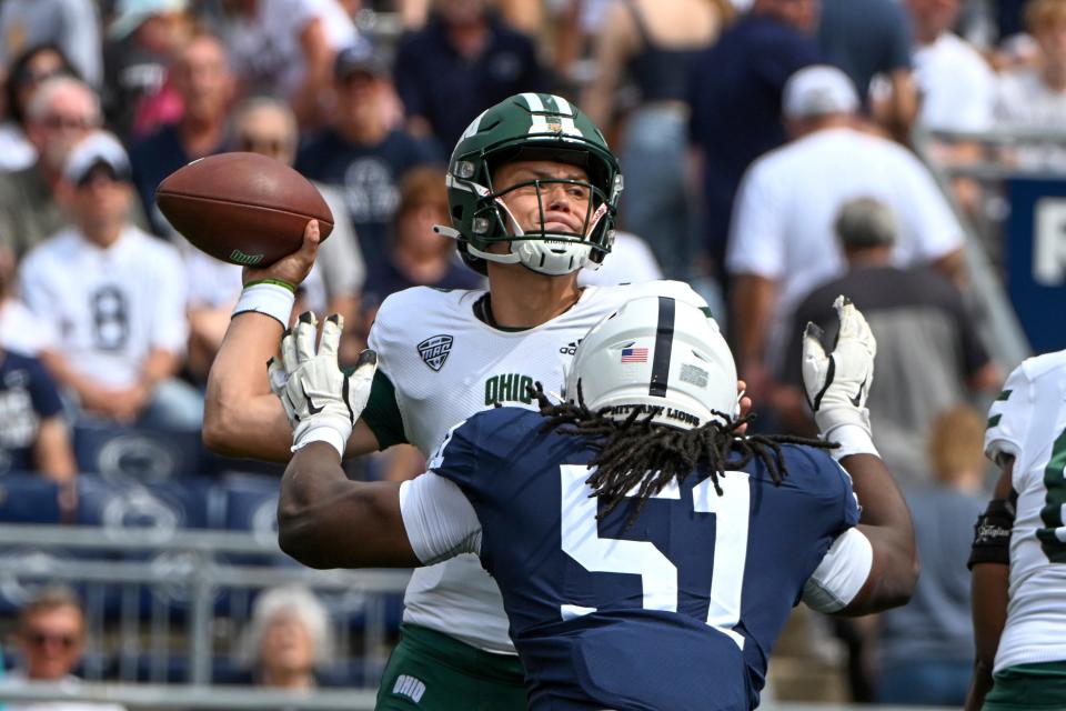 Ohio quarterback Kurtis Rourke (7) throws a pass while being pressured by Penn State defensive tackle Hakeem Beamon (51) in the first half of an NCAA college football game, Saturday, Sept. 10, 2022, in State College, Pa. (AP Photo/Barry Reeger)