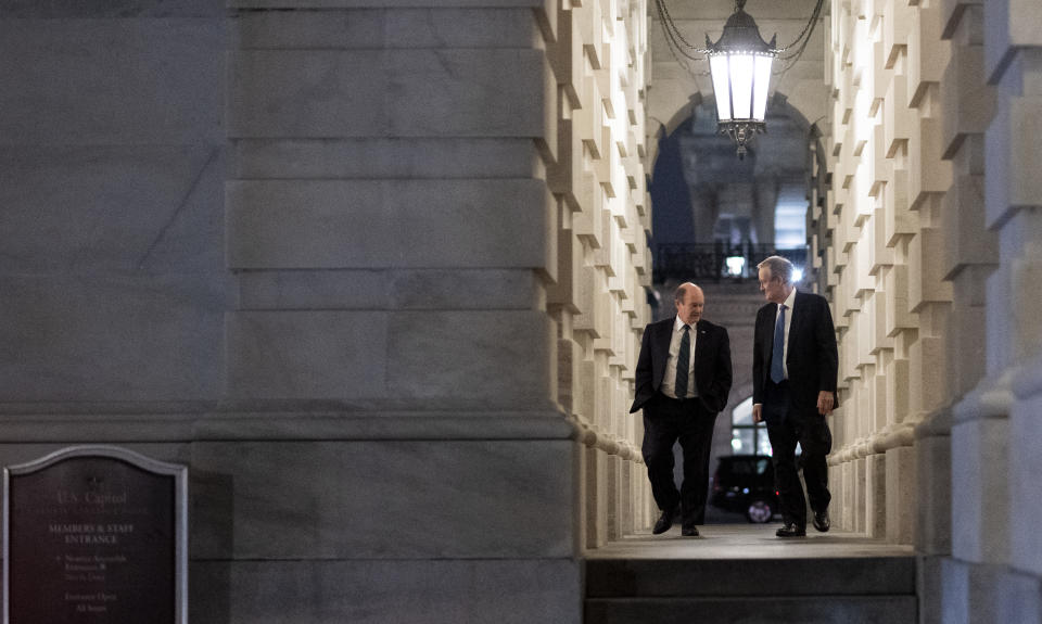 UNITED STATES - MARCH 25: Sen. Mike Crapo, R-Idaho, and Sen. Chris Coons, D-Del., leave the Capitol after voting on the Coronavirus Aid, Relief, and Economic Security Act in the Capitol on Wednesday night, March 25, 2020. (Photo By Bill Clark/CQ-Roll Call, Inc via Getty Images)