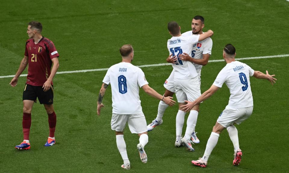 <span>Ivan Schranz (second right) celebrates with Slovakia teammates after scoring what proved to be an early winner against Belgium.</span><span>Photograph: Angelos Tzortzinis/AFP/Getty Images</span>