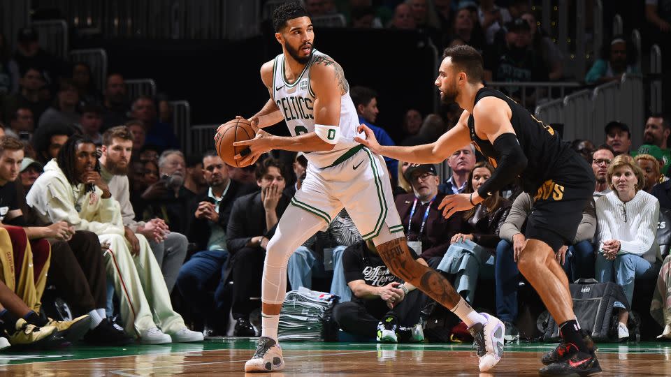 Tatum is defended by Max Strus during the game. - Brian Babineau/NBAE/Getty Images