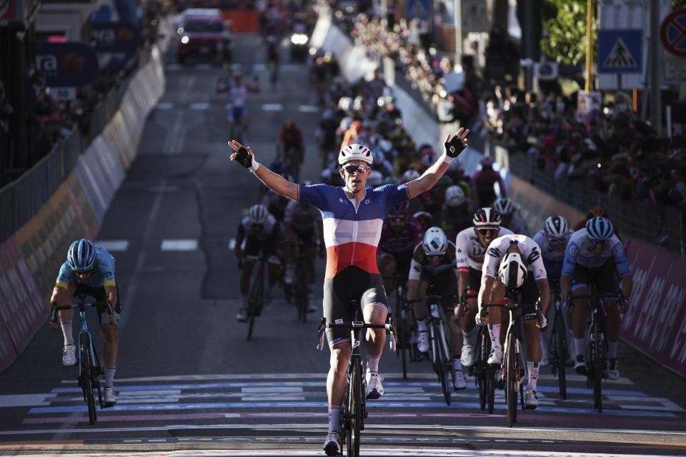 France's Arnaud Demare celebrates crossing the finish line to win the sixth stage of the Giro d'Italia cycling race, from Castrovillari to Matera, southern Italy, Thursday, Oct. 8, 2020. (Gian Mattia D'Alberto/LaPresse via AP)