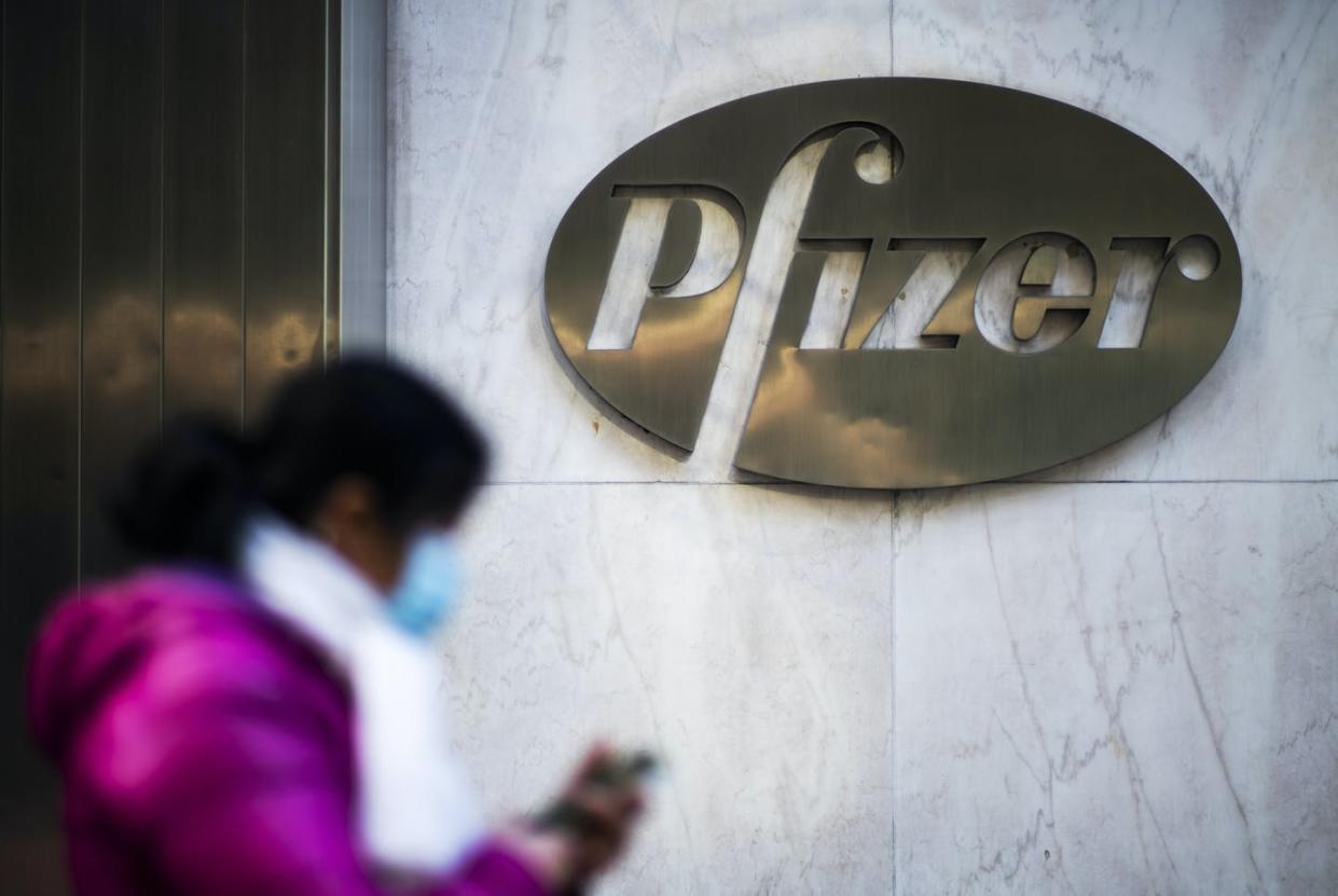 <span class="caption">The drug maker company Pfizer says its COVID-19 vaccine is 95% effective with no serious side effects.</span> <span class="attribution"><a class="link " href="https://www.gettyimages.com/detail/news-photo/woman-walks-in-front-of-pfizer-headquarters-on-november-18-news-photo/1286417492?adppopup=true" rel="nofollow noopener" target="_blank" data-ylk="slk:Eduardo Munoz Alvarez/VIEW press/Corbis News via Getty Images;elm:context_link;itc:0;sec:content-canvas">Eduardo Munoz Alvarez/VIEW press/Corbis News via Getty Images</a></span>