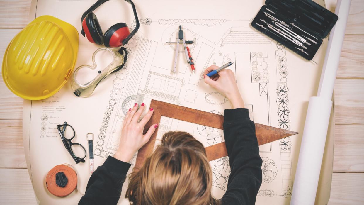 Young architect doing work in her studio.