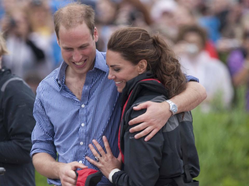 Prince William and Kate Middleton hug during their 2011 tour of Canada as newlyweds