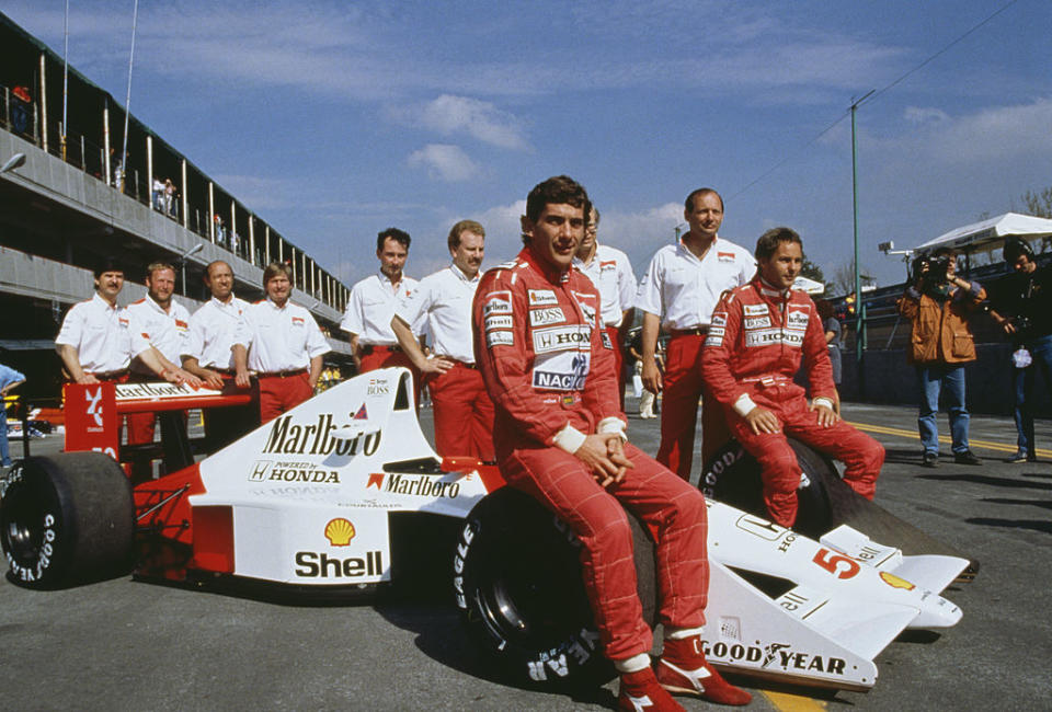 Ayrton Senna and his team in 1990.