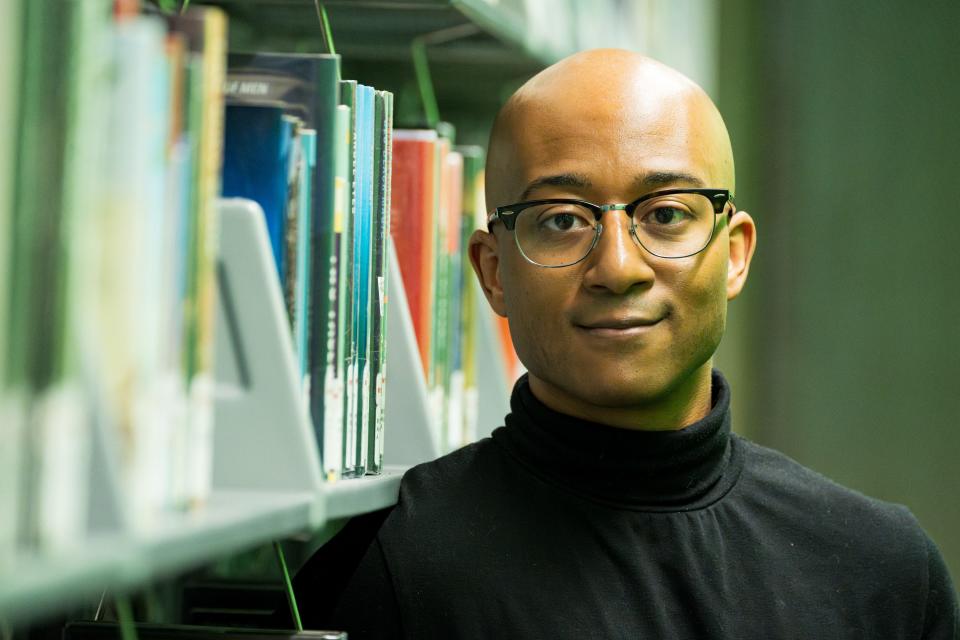 Author James Ramos poses for a portrait at Burton Barr Central Library on March 17, 2024, in Phoenix.