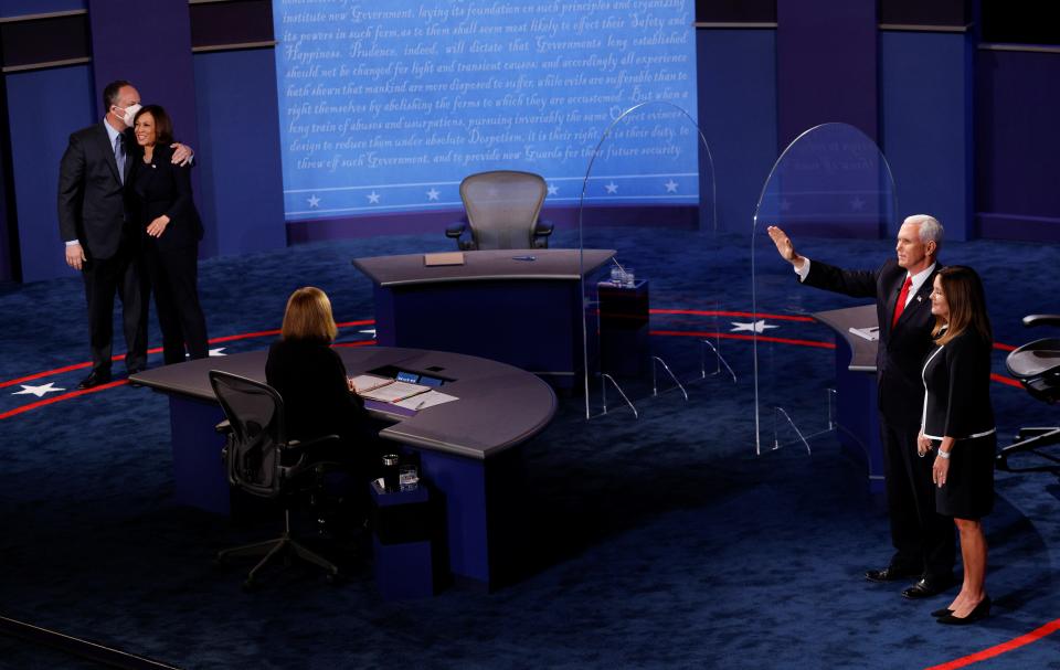 Democratic vice presidential nominee Senator Kamala Harris and vice president Mike Pence after their 2020 campaign debate in Salt Lake City (Reuters)