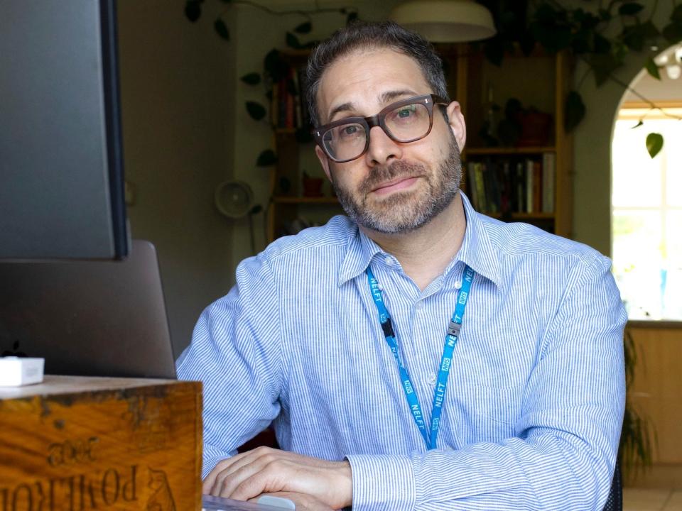 mark sitting at desk