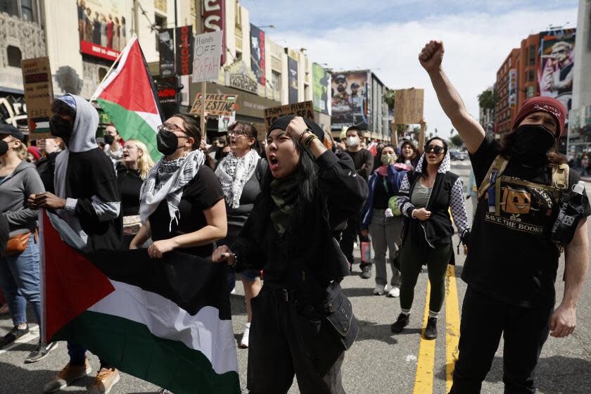 Los Angeles, CA - March 10: Protester demand an immediate and permanent ceasefire and an end to the blockade of Gaza and the occupation of Palestine in Oscar Rally and March in Hollywood on Sunday, March 10, 2024 in Los Angeles, CA. (Gina Ferazzi / Los Angeles Times)