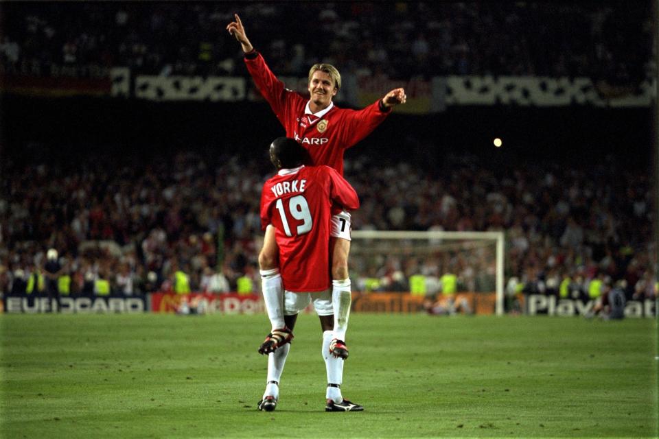 David Beckham and Dwight Yorke celebrate after victory in the UEFA Champions League Final between Bayern Munich v Manchester United at the Nou camp Stadium on 26 May, 1999 in Barcelona, Spain. Bayern Munich 1 Manchester United 2.