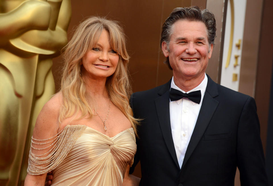 Goldie Hawn, left, and Kurt Russell arrive at the Oscars on Sunday, March 2, 2014, at the Dolby Theatre in Los Angeles. (Photo by Jordan Strauss/Invision/AP)