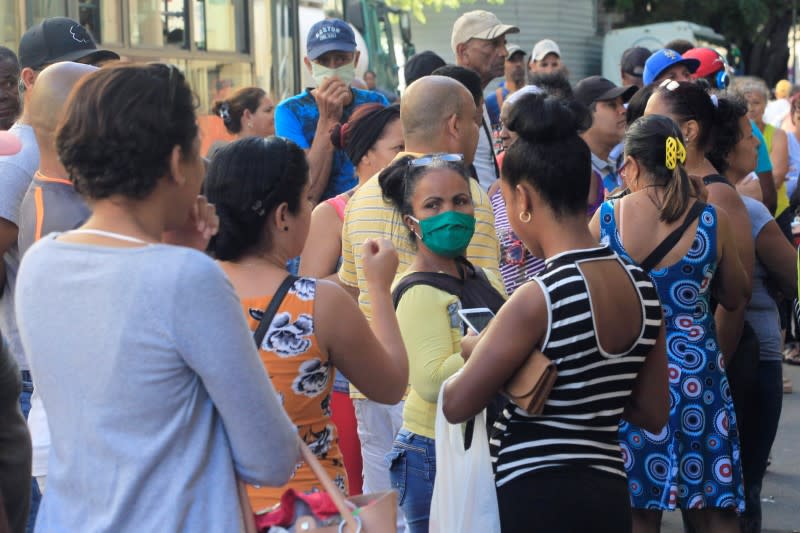 People line up to buy food, amid concerns about the spread of the coronavirus disease (COVID-19) outbreak, in Havana