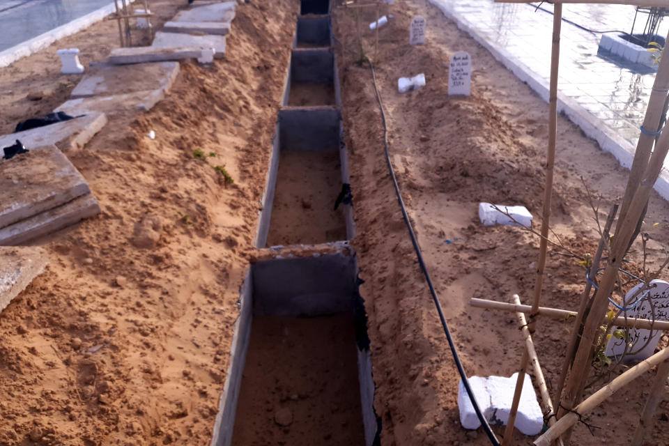 Graves are prepared at the cemetery for migrants who have died trying to reach Europe, in the village of Zarzis, Tunisia, Saturday June 12, 2021. A newly sanctified cemetery for Tunisia's migrant dead is filling quickly. Rachid Koraïchi bought the plot of land in the port city of Zarzis a few years ago and started designing what he hoped would be the final resting place for people who died on the move. (AP Photo/Mehdi El Arem)