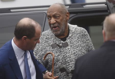 Actor and comedian Bill Cosby (C) arrives for his arraignment on sexual assault charges at the Montgomery County Courthouse in Elkins Park, Pennsylvania December 30, 2015. REUTERS/Mark Makela