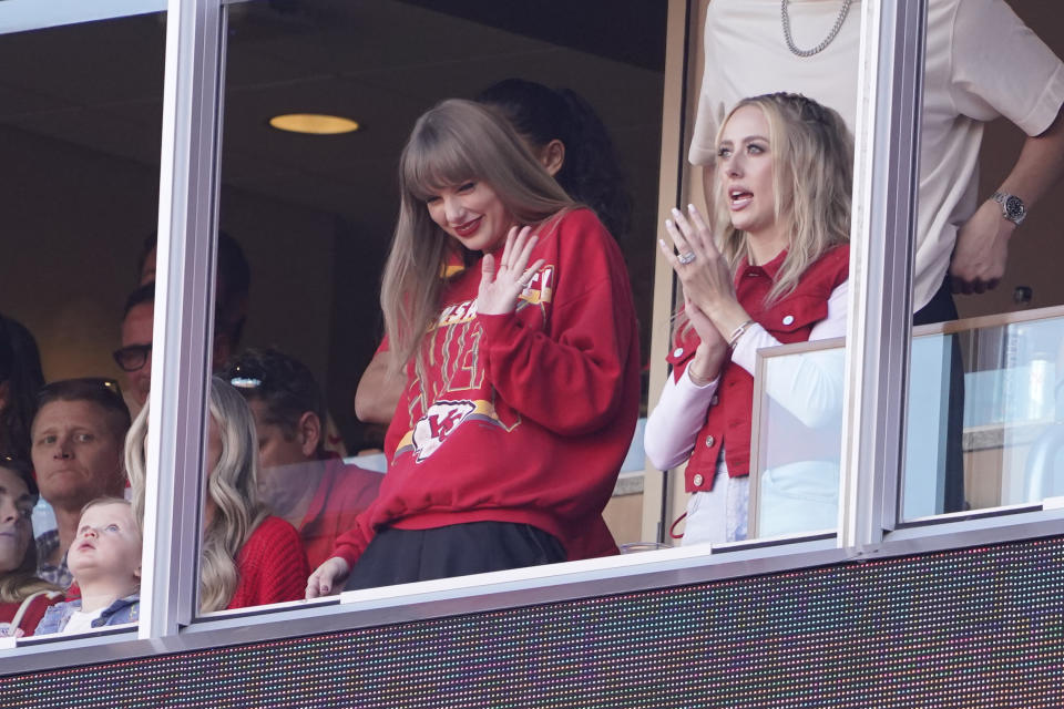 FILE - Taylor Swift waves from a suite alongside Brittany Mahomes, right, during the first half of an NFL football game between the Kansas City Chiefs and the Los Angeles Chargers, Oct. 22, 2023, in Kansas City, Mo. Sean Kammer, a South Dakota law professor who typically teaches torts and natural resources, is turning his attention to Taylor Swift next semester. The self-described “Swiftie” wants to draw on music and art to help his students reconsider legal language and craft persuasive arguments. (AP Photo/Ed Zurga, File)