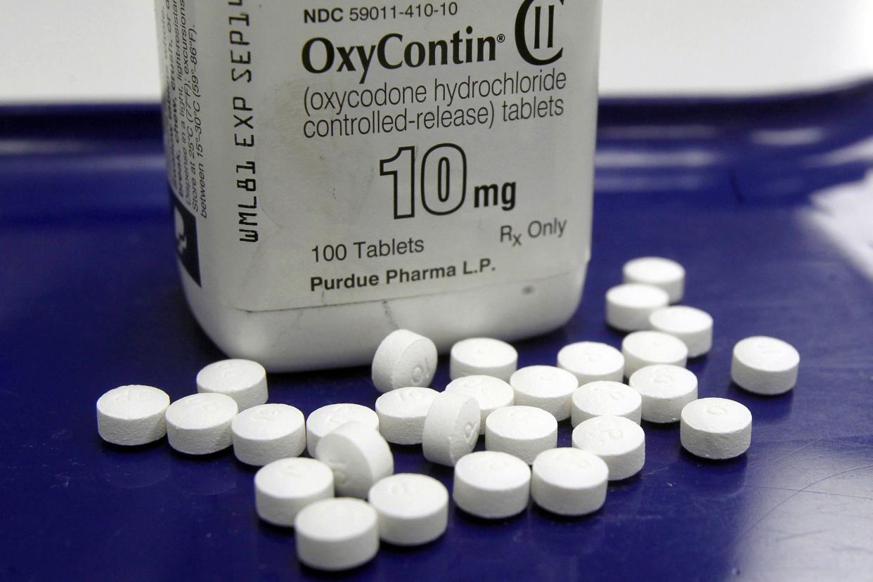 FILE - OxyContin pills arranged for a photo at a pharmacy, Feb. 19, 2013 in Montpelier, Vt. 