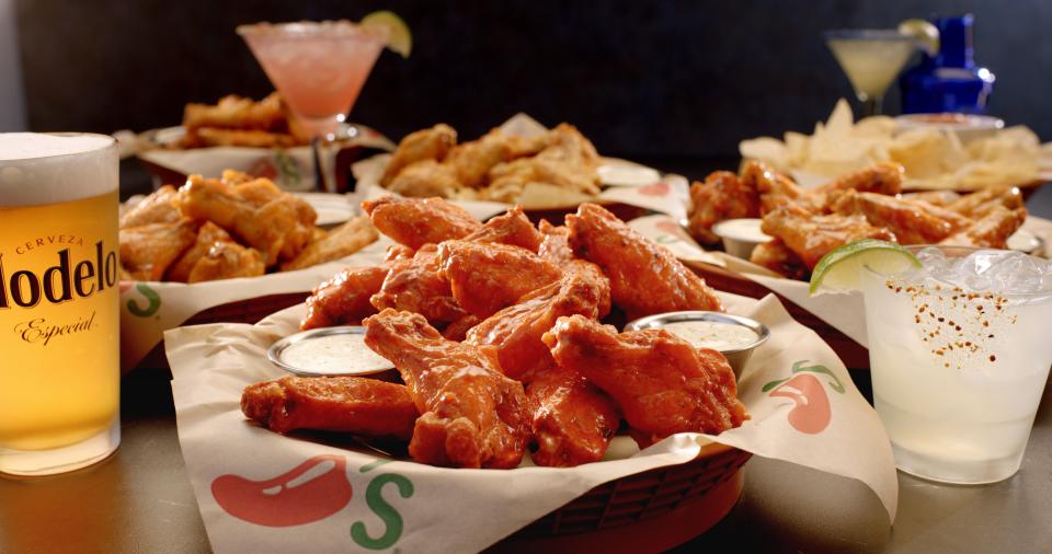 At Chili's during the football season, when there's a game on TV, it's happy hour with specials on drinks and food. On Mondays during the football season when you buy one 8-count boneless chicken wings, you get another free (available in-restaurant and at the bar).