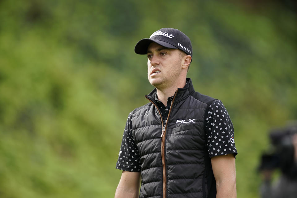 Justin Thomas grimaces after hitting his tee shot into the rough on the seventh hole as first round play continues during the Genesis Open golf tournament at Riviera Country Club on Friday, Feb. 15, 2019, in the Pacific Palisades area of Los Angeles. (AP Photo/Ryan Kang)