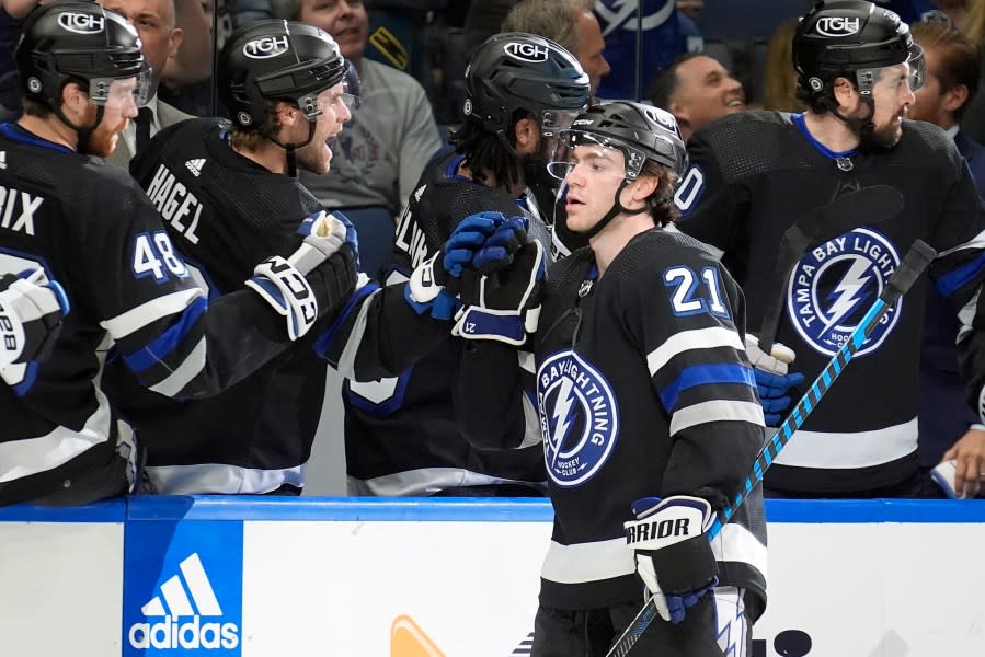 Tampa Bay Lightning center Brayden Point (21) celebrates with the bench after his goal against the Philadelphia Flyers during the first period of an NHL hockey game Saturday, March 9, 2024, in Tampa, Fla. (AP Photo/Chris O’Meara)