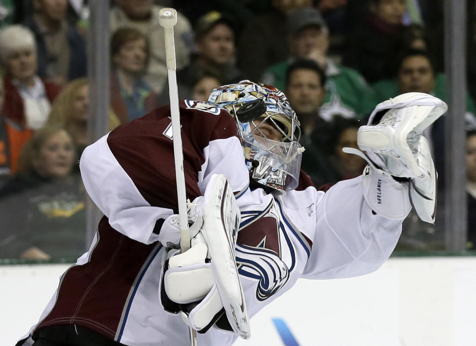 Colorado Avalanche goalie Semyon Varlamov (1), of Russia, stops a shot from the Dallas Stars in the first period of an NHL hockey game, Monday, Jan. 27, 2014, in Dallas. (AP Photo/Tony Gutierrez)
