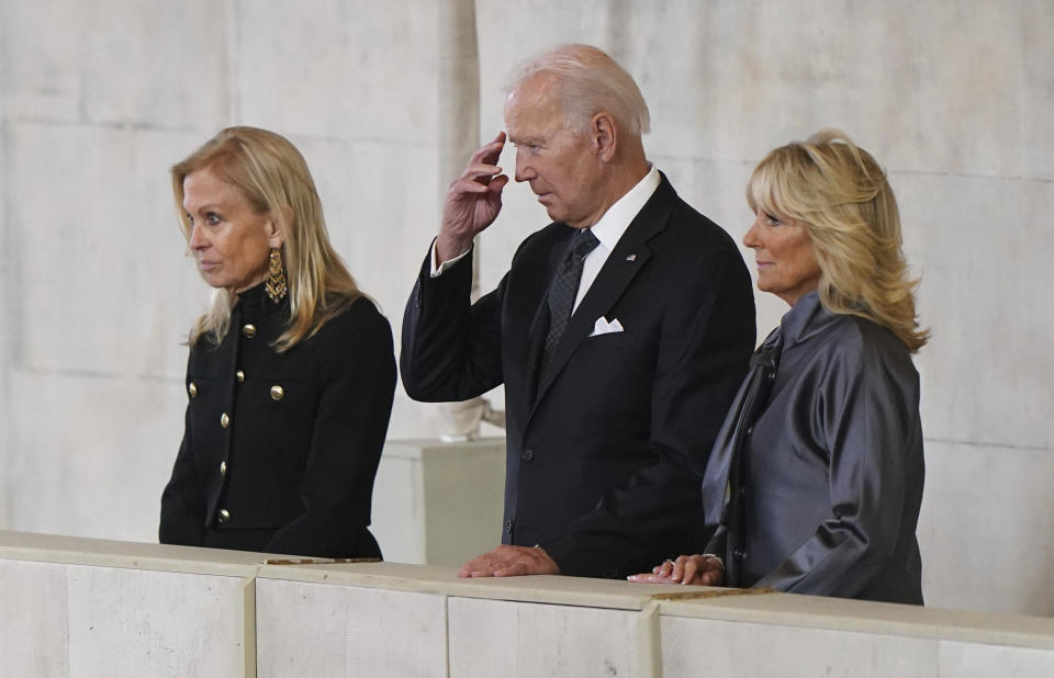 US President Joe Biden and First Lady Jill Biden view the coffin of Queen Elizabeth II lying in state on the catafalque in Westminster Hall, at the Palace of Westminster, London, Sunday Sept. 18, 2022. (Joe Giddens/Pool Photo via AP)