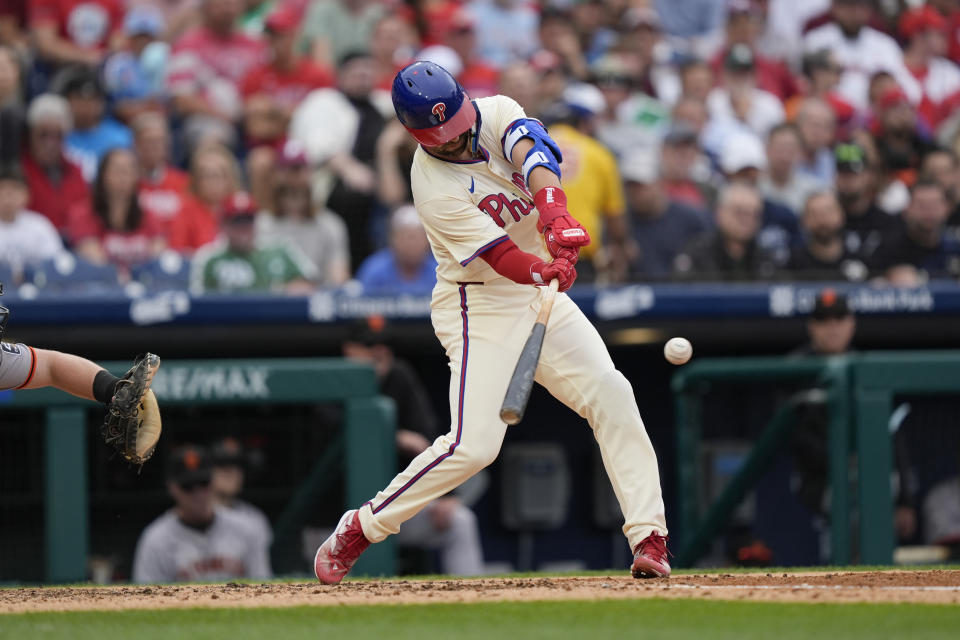 Philadelphia Phillies' Whit Merrifield hits an RBI single off San Francisco Giants pitcher Mason Black during the fourth inning of a baseball game, Monday, May 6, 2024, in Philadelphia. (AP Photo/Matt Rourke)