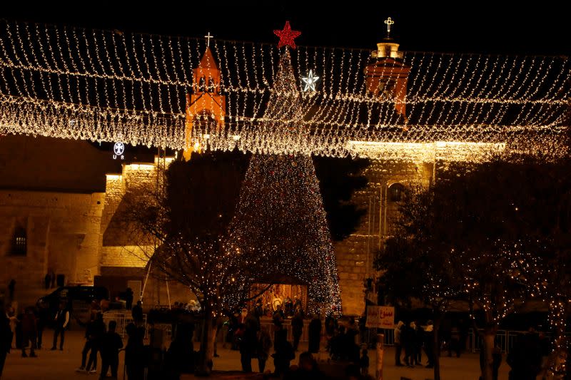 People stand at Manger Square in Bethlehem in the Israeli-occupied West Bank