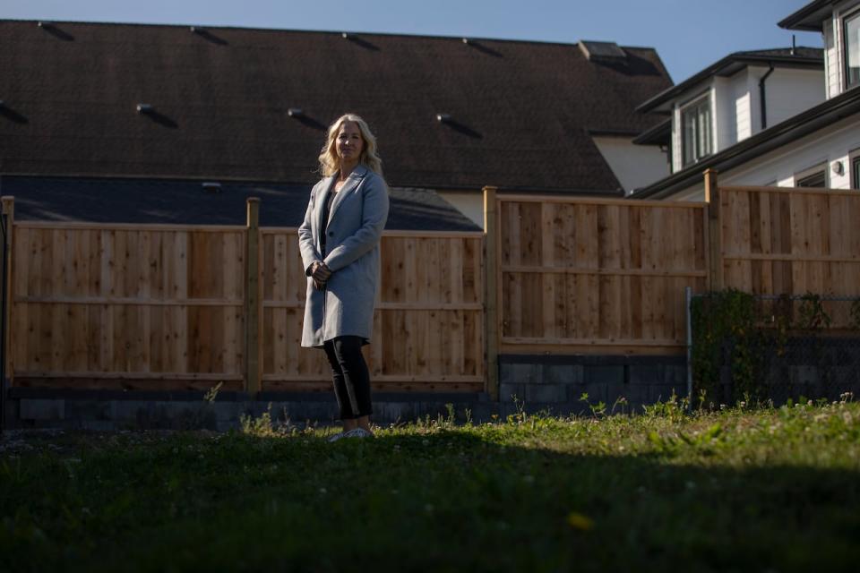 Jacqueline Dupuis, executive director at Aunt Leah’s place, says the backyard at one of  its existing homes is ready for a laneway house. Once built, the 1,500 square-foot, two-storey home will house up to three vulnerable moms and their babies. 