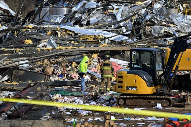 PHOTO: Emergency response workers dig through the rubble of the Mayfield Consumer Products candle factory in Mayfield, Ky., on Dec. 11, 2021.  (Timothy D. Easley/AP)