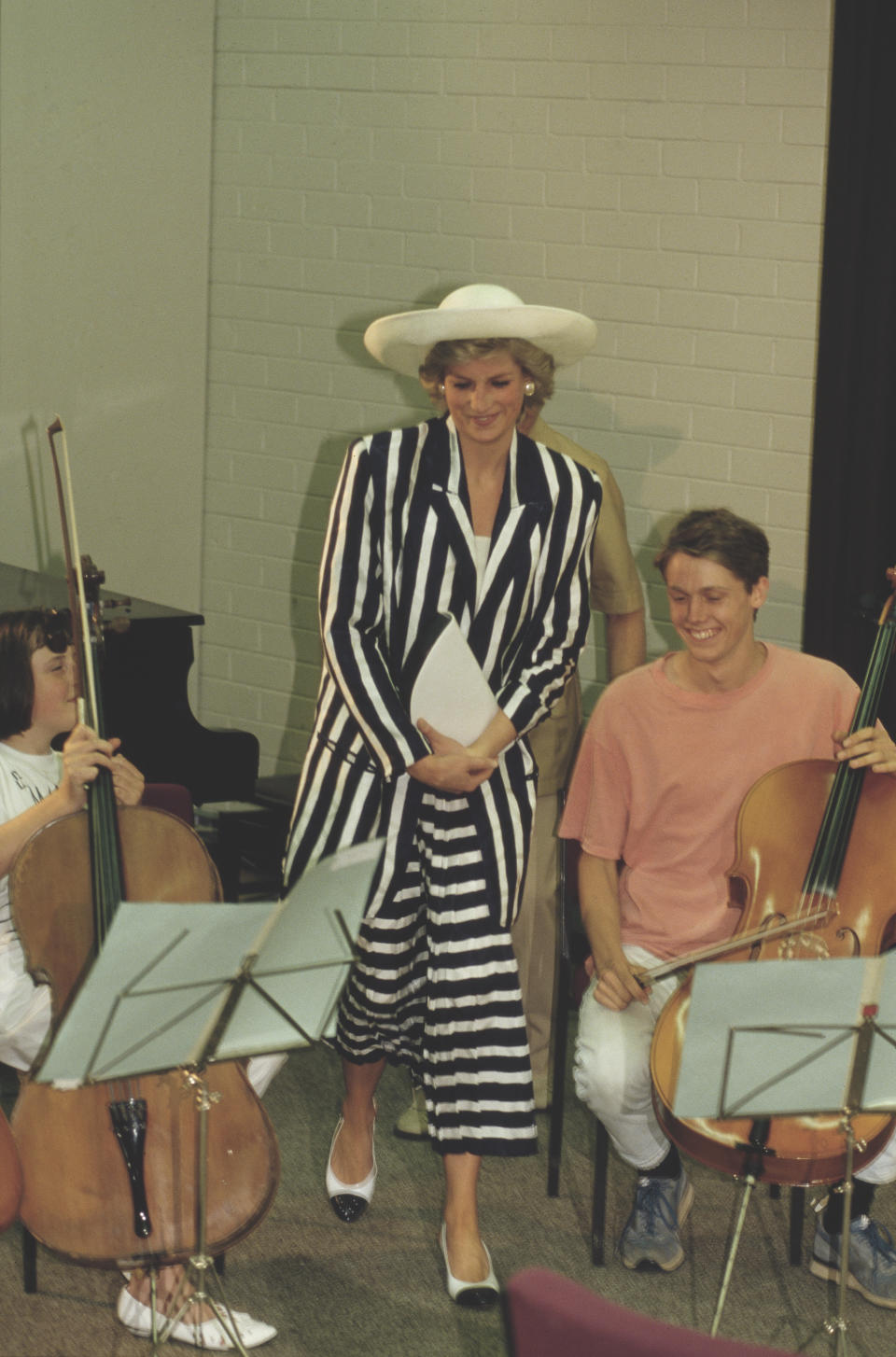 Diana, Princess of Wales  (1961 - 1997) visits the Music College of the Victorian College of the Arts in Melbourne, Australia, January 1988. She is wearing a black and white striped dress by Roland Klein.  (Photo by Jayne Fincher/Princess Diana Archive/Getty Images)