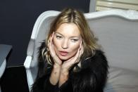 <p>A small anchor adorns Kate Moss's lower forearm.</p>