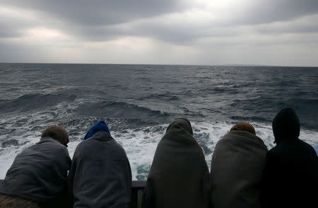Migrants are seen aboard the former fishing trawler Golfo Azzurro, following their rescue about thirty-two hours ago from their drifting dinghies by Spanish NGO Proactiva Open Arms, in the Mediterranean Sea, off the Libyan coast April 2, 2017. REUTERS/Yannis Behrakis
