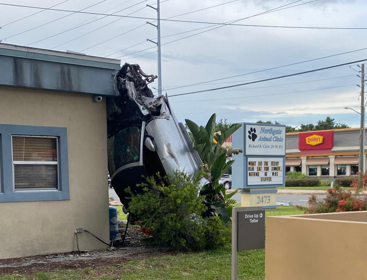 A Jaguar estimated to be traveling more than 100 mph slammed into a Cadillac Escalade at the intersection of Martin Luther King Drive and U.S. Highway 441/27 Monday evening, causing an explosion of car parts and the speeding car to flip onto the side of a building several feet away. The teenage driver was airlifted following the crash.