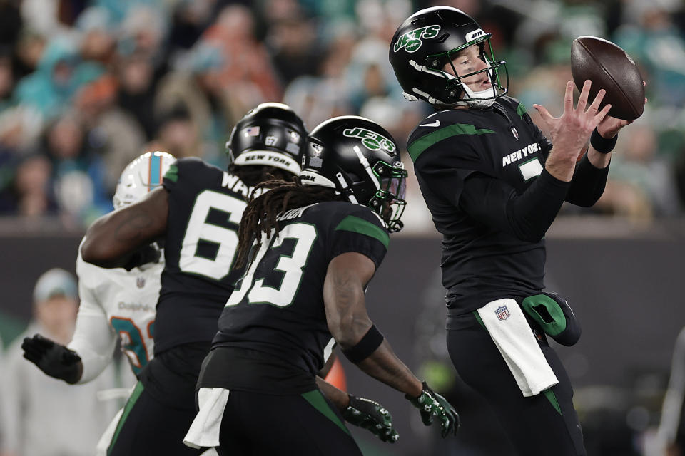 New York Jets quarterback Tim Boyle (7) bobbles the ball during the fourth quarter of an NFL football game against the Miami Dolphins, Friday, Nov. 24, 2023, in East Rutherford, N.J. (AP Photo/Adam Hunger)