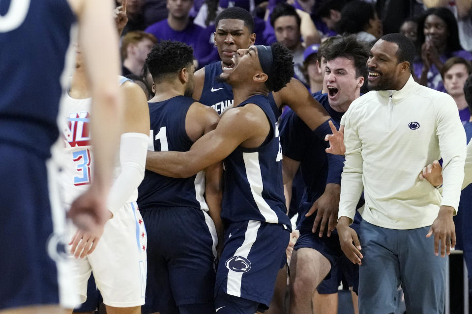Penn State guard Jalen Pickett, right front, celebrates with guard Camren Wynter (11) afte Wynter scored a 3-point basket against Northwestern in overtime of an NCAA college basketball game in Evanston, Ill., Wednesday, March 1, 2023. Penn State won 68-65. (AP Photo/Nam Y. Huh)