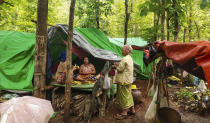 Internally displaced women talk at their makeshift tents at Pu Phar Village, Demawso Township, Kayah State on Thursday, June 17, 2021. A report on the situation in conflict-affected areas of Myanmar issued this week by the U.N.'s Office for the Coordination of Humanitarian Affairs says around 108,800 people from Kayah State were internally displaced following an escalation of hostilities between the government military and the local Karenni People's Defense Force militia since the coup Feb. 1, 2021. (AP Photo)