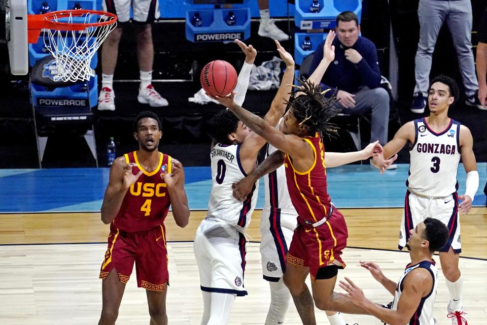 Mar 30, 2021; Indianapolis, IN, USA; USC Trojans guard Isaiah White (5) shoots the ball against Gonzaga Bulldogs guard Julian Strawther (0) during the first half in the Elite Eight of the 2021 NCAA Tournament at Lucas Oil Stadium. Mandatory Credit: Robert Deutsch-USA TODAY Sports