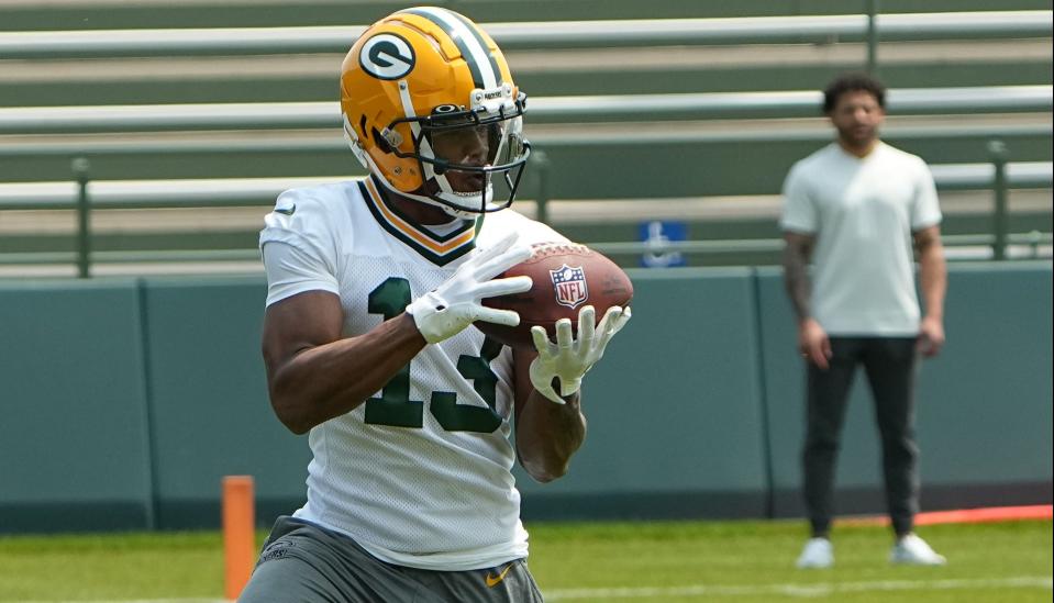 Green Bay Packers wide receiver <a class="link " href="https://sports.yahoo.com/nfl/players/40201" data-i13n="sec:content-canvas;subsec:anchor_text;elm:context_link" data-ylk="slk:Dontayvion Wicks;sec:content-canvas;subsec:anchor_text;elm:context_link;itc:0">Dontayvion Wicks</a> (13) is shown during organized team activities Tuesday, May 23, 2023 in Green Bay, Wis.