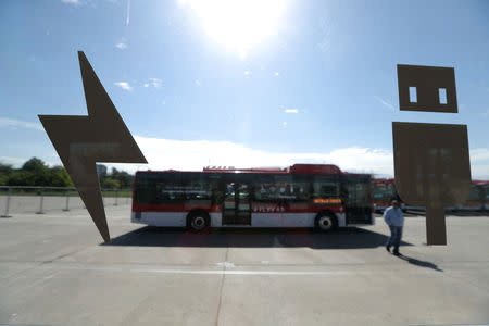 Electric buses part of the new fleet of electric buses for public transport launched by Chile's government, is seen parked in Santiago, Chile December 13, 2018. REUTERS/Ivan Alvarado