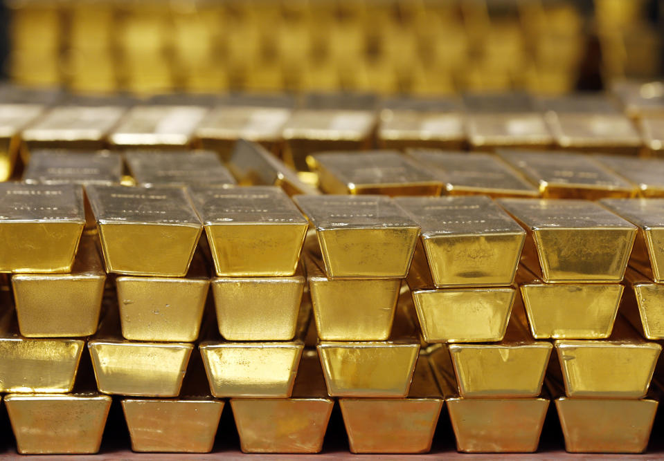 FILE - Gold bars are shown stacked in a vault at the United States Mint, on July 22, 2014, in West Point, N.Y. (AP Photo/Mike Groll, File)