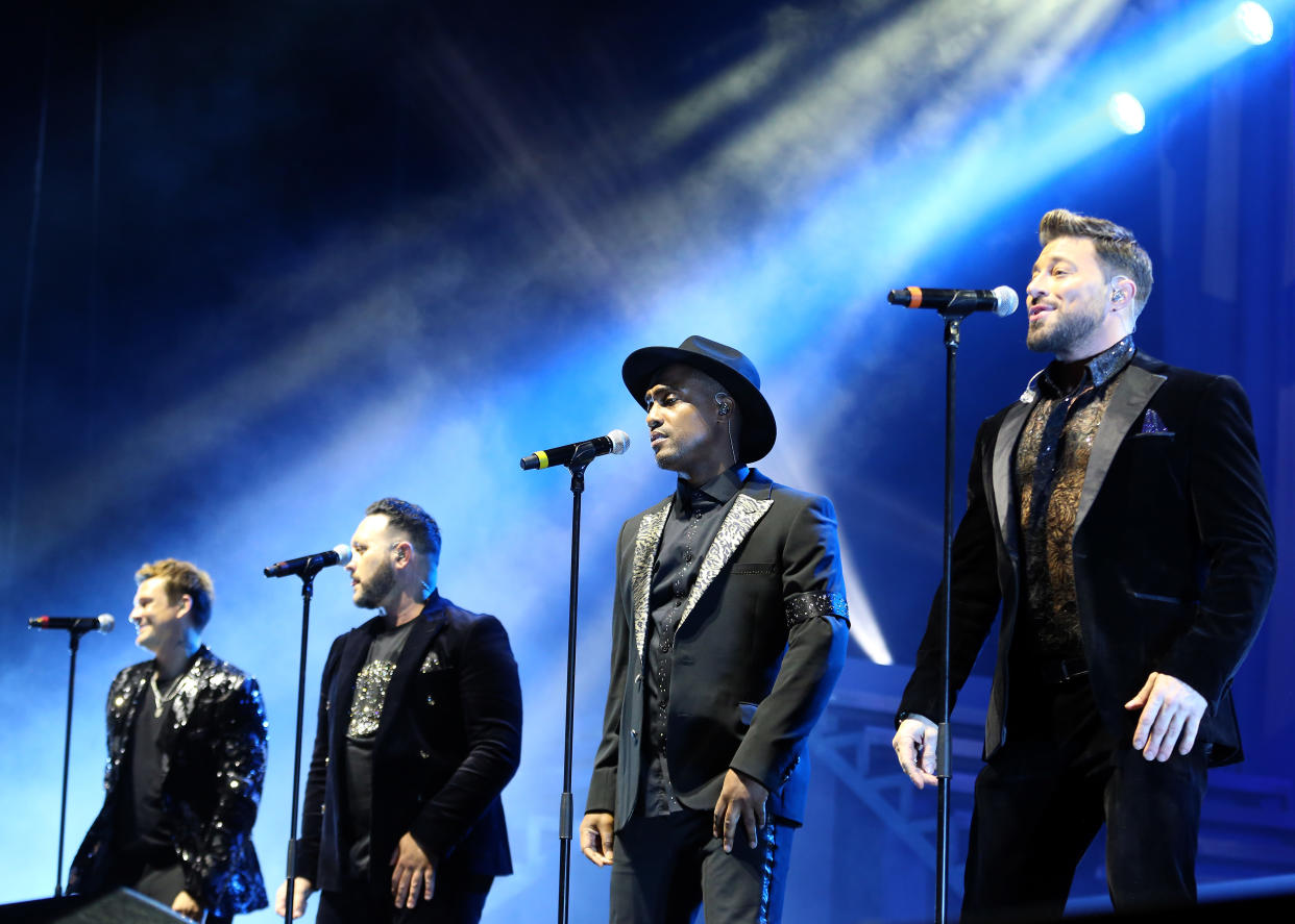 LONDON, ENGLAND - DECEMBER 13: (L-R) Lee Ryan, Antony Costa, Simon Webbe and Duncan James of Blue perform live on stage during their 20th anniversary Heart and Soul tour at The O2 Arena on December 13, 2022 in London, England. (Photo by Simone Joyner/Getty Images )