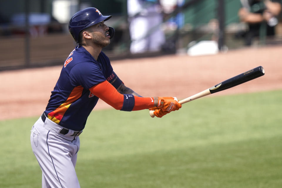 Houston Astros' Carlos Correa watches after fouling out during the first inning of a spring training baseball game against the Miami Marlins, Friday, March 5, 2021, in Jupiter, Fla. (AP Photo/Lynne Sladky)