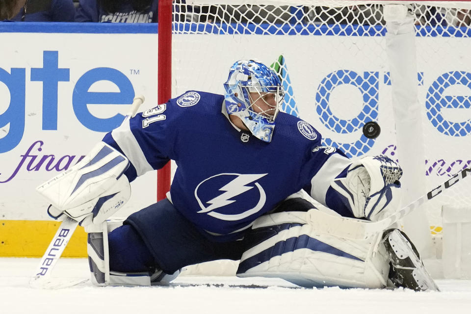 Tampa Bay Lightning goaltender Jonas Johansson (31) can't make the save on an overtime goal by Seattle Kraken left wing Jared McCann during an NHL hockey game Monday, Oct. 30, 2023, in Tampa, Fla. (AP Photo/Chris O'Meara)