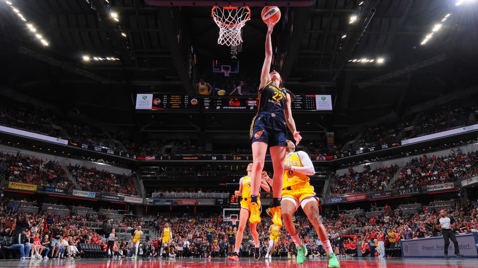 Clark drives to the basket during the game. - Ron Hoskins/NBAE/Getty Images