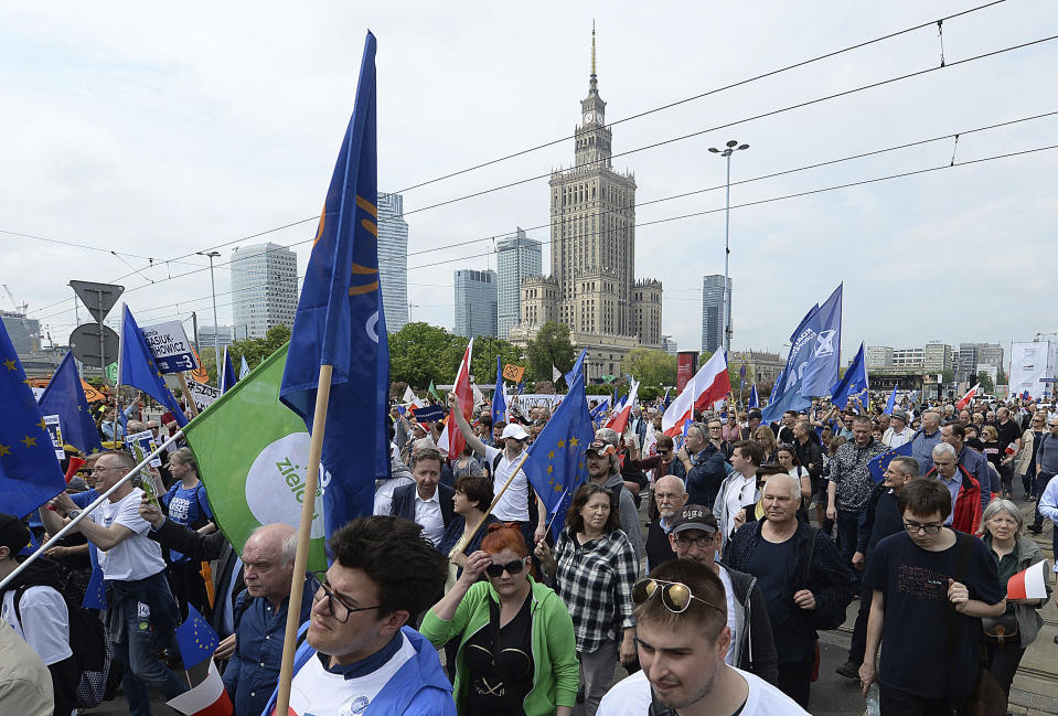 Thousands of Poles with pro-European banners march to celebrate Poland's 15 years in the EU and stressing the nation's attachment to the 28-member bloc ahead of May 26 key elections to the European Parliament, in Warsaw, Poland, Saturday, May 18, 2019. (AP Photo/Czarek Sokolowski)