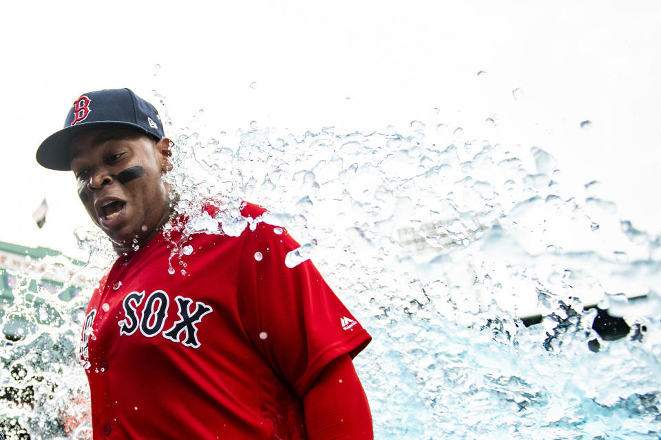 BOSTON, MA - AUGUST 18: Rafael Devers #11 of the Boston Red Sox reacts as he is doused with Gatorade after  a game against the Baltimore Orioles on August 18, 2019 at Fenway Park in Boston, Massachusetts. (Photo by Billie Weiss/Boston Red Sox/Getty Images)